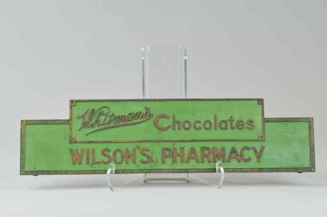 Appraisal: WHITMAN'S CHOCOLATE BRASS PLAQUE Heavily cast by Imperial Brass Co