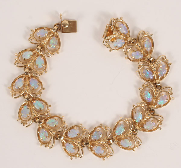 Appraisal: Gold K butterfly motif link bracelet set with oval opals