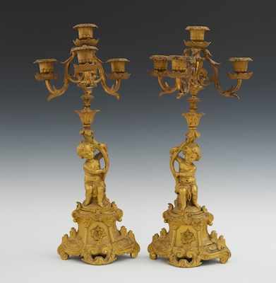 Appraisal: A Pair of Louis XV Style Ormolu Cherub Four Light