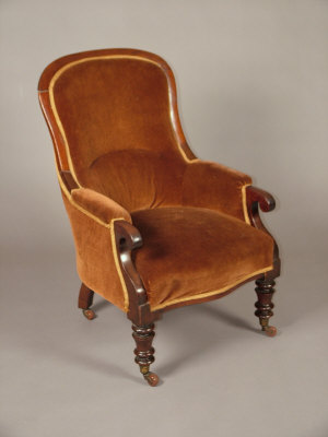 Appraisal: A Victorian mahogany framed armchair the shaped padded back over