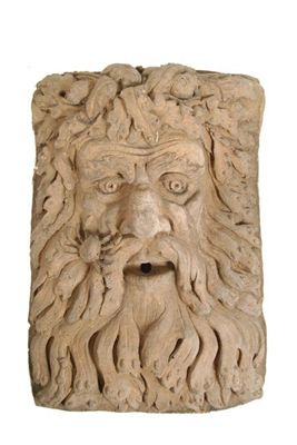 Appraisal: A terracotta fountain head with the mask of a river