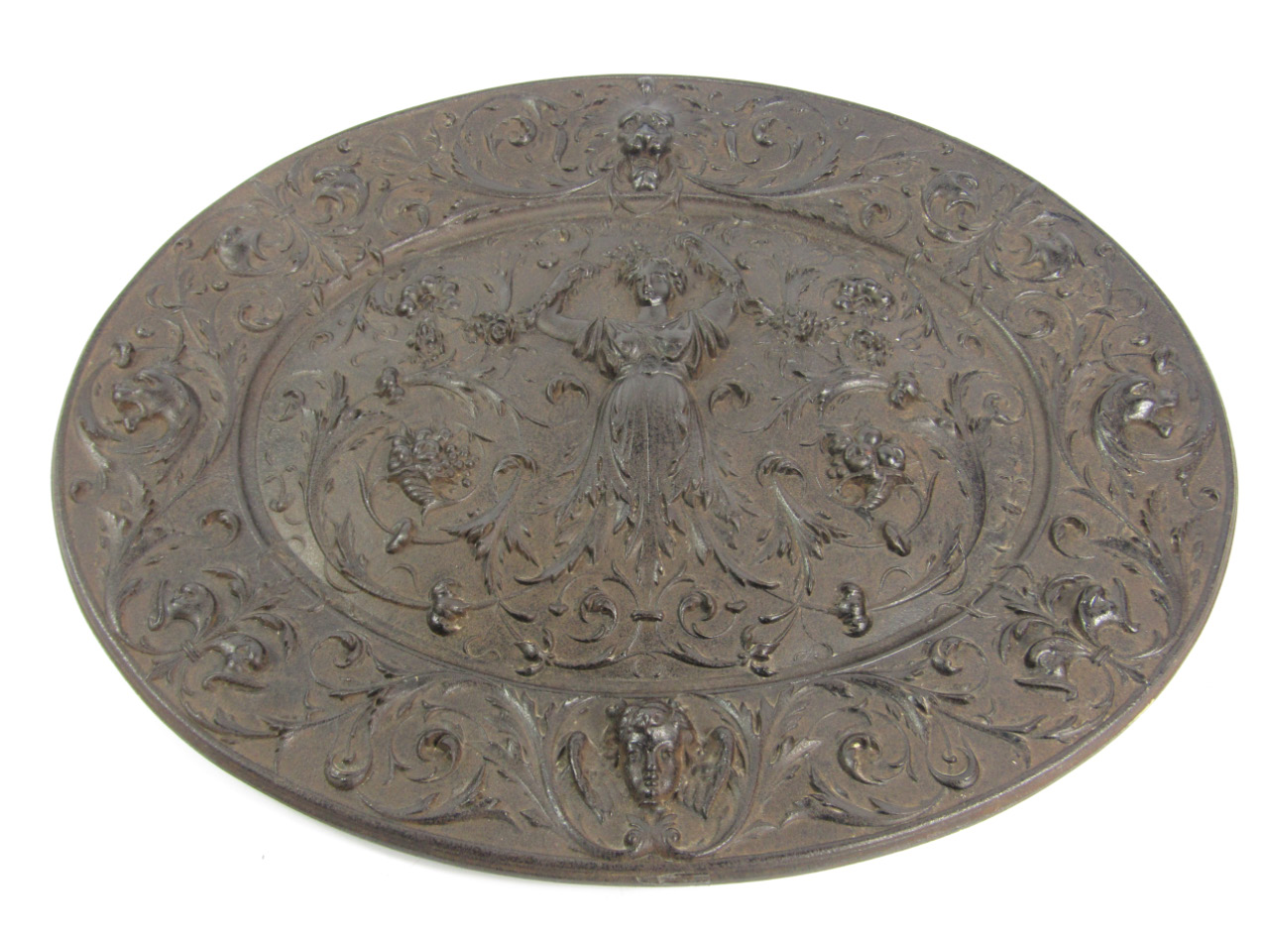 Appraisal: A Victorian cast iron oval wall plaque embossed in Florentine