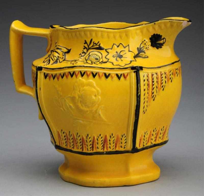 Appraisal: Extremely Rare Yellow Canary Cream Pitcher With embossed eagle decoration