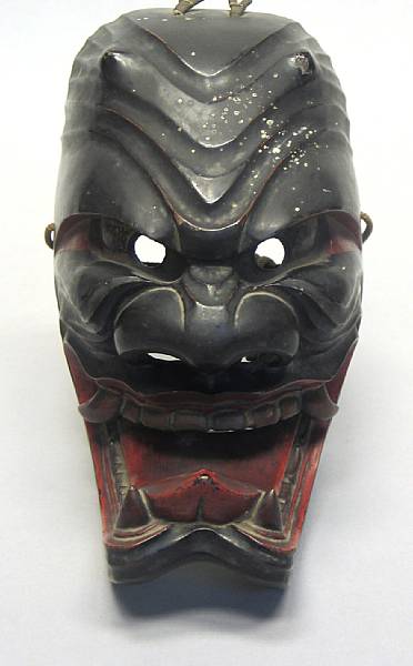 Appraisal: A Japanese polychrome lacquered wood demon mask wear height in