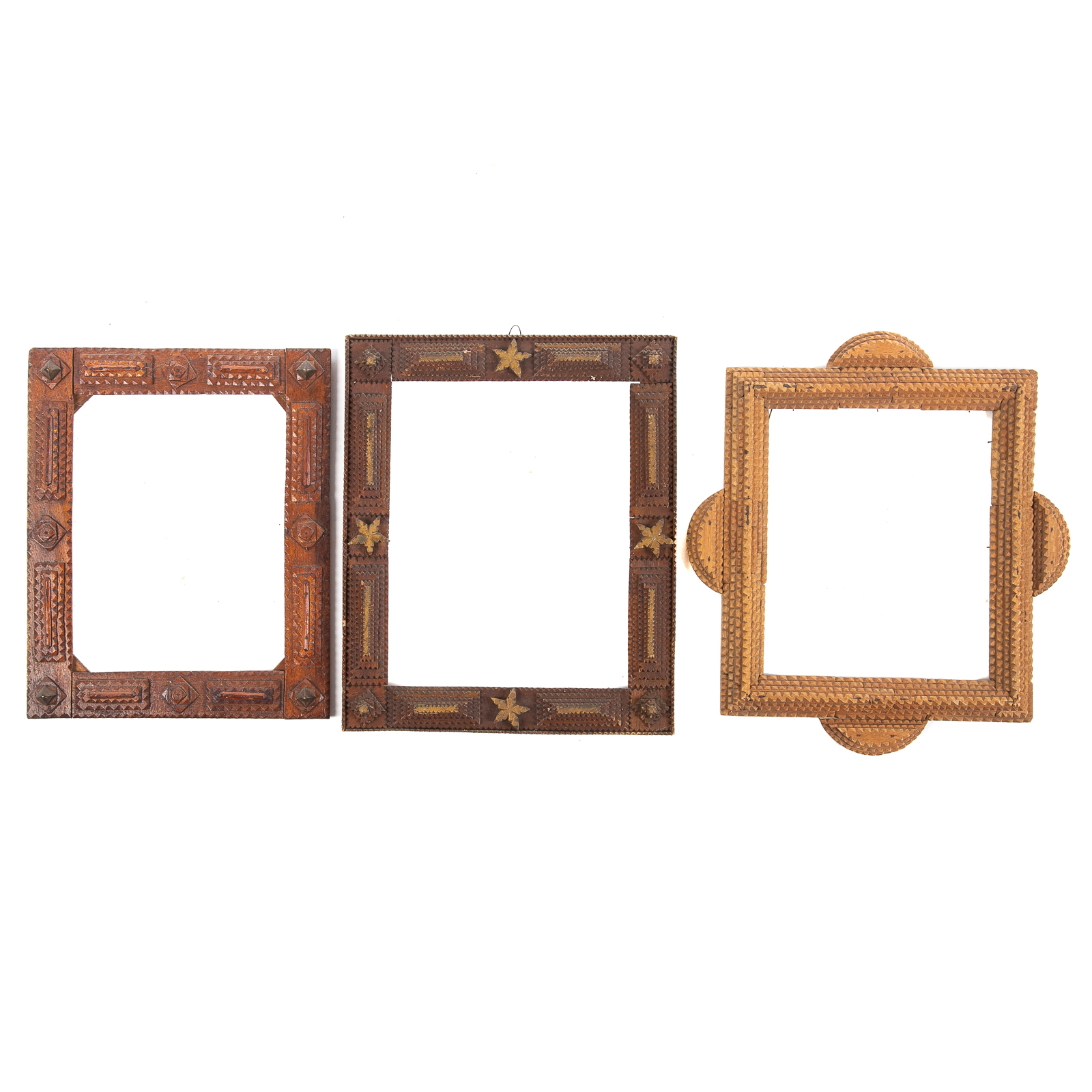 Appraisal: THREE TRAMP ART NOTCH CARVED FRAMES One with partial gold