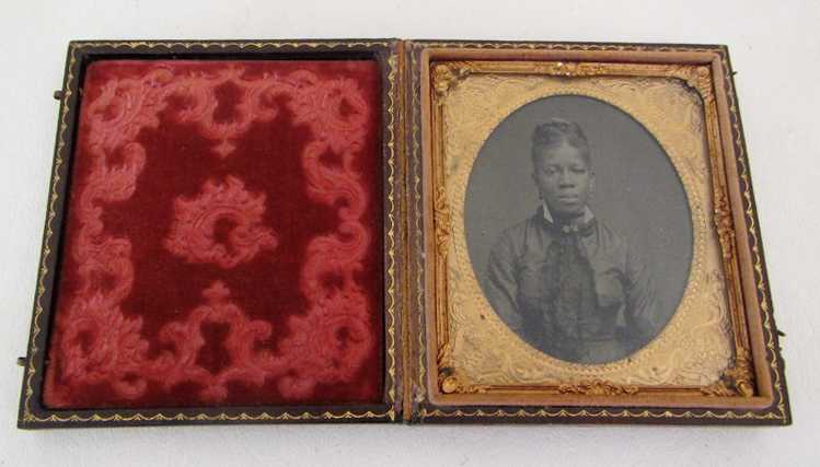 Appraisal: TINTYPE PHOTO OF AN AFRICAN AMERICAN WOMAN plate framed in