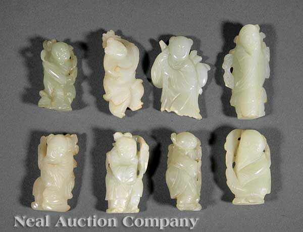 Appraisal: A Group of Eight Chinese Carved Jade Figures seven pale