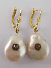 Appraisal: A pair of baroque freshwater pearl earrings the centres set