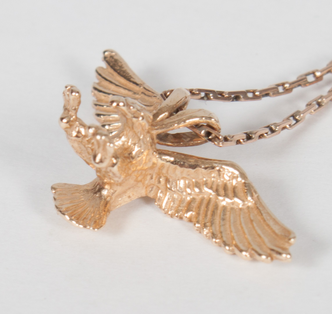 Appraisal: K gold eagle pendant a thin rose gold necklace pendant