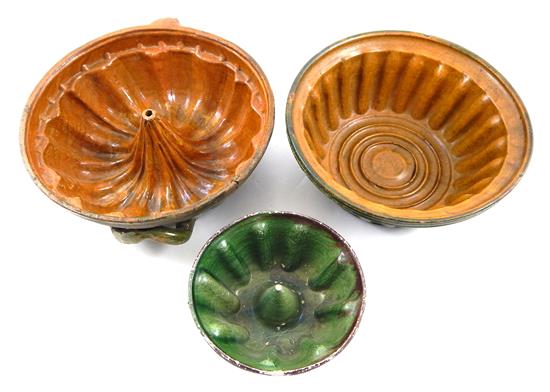 Appraisal: Three th C American pudding molds redware bundt form mold