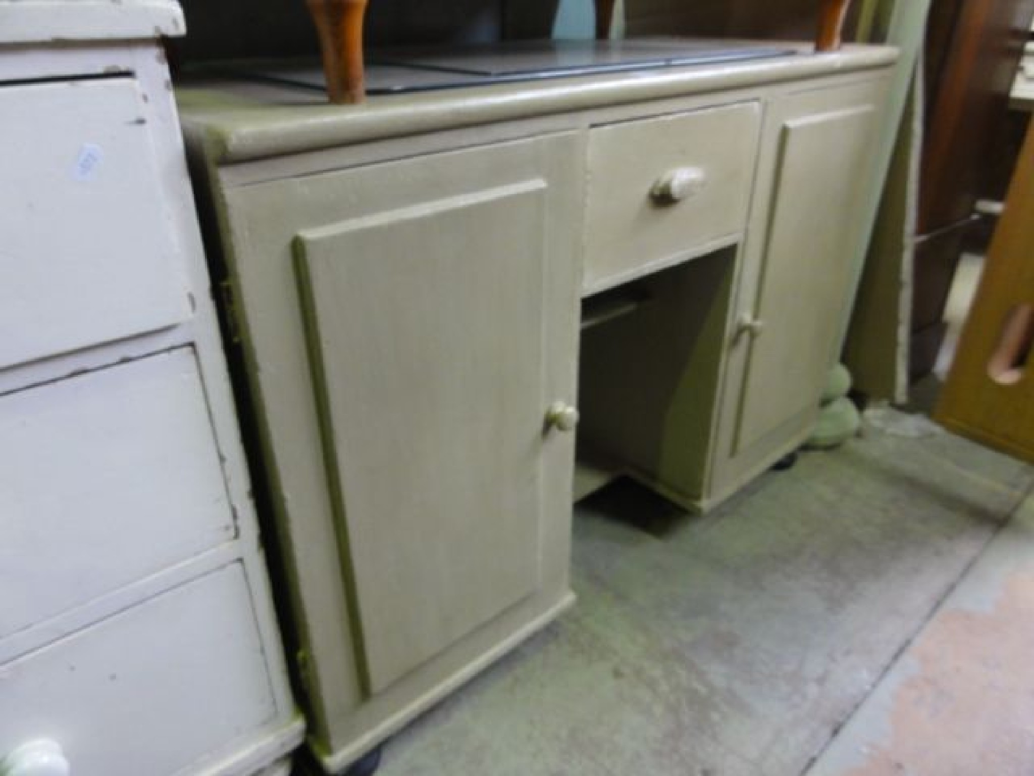 Appraisal: A Victorian pine side cupboard dresser base enclosed by a