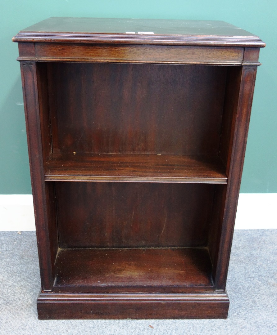 Appraisal: A mahogany revolving open double sided bookcase on plinth base