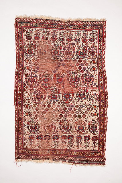 Appraisal: AN ANTIQUE QUASHGAI RUG with all over flower and gul