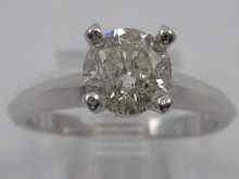 Appraisal: A white metal tests ct gold diamond solitaire ring the