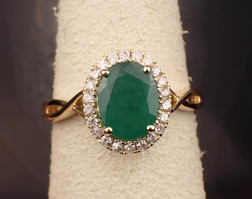 Appraisal: EMERALD DIAMOND AND FOURTEEN KARAT GOLD RING The K yellow