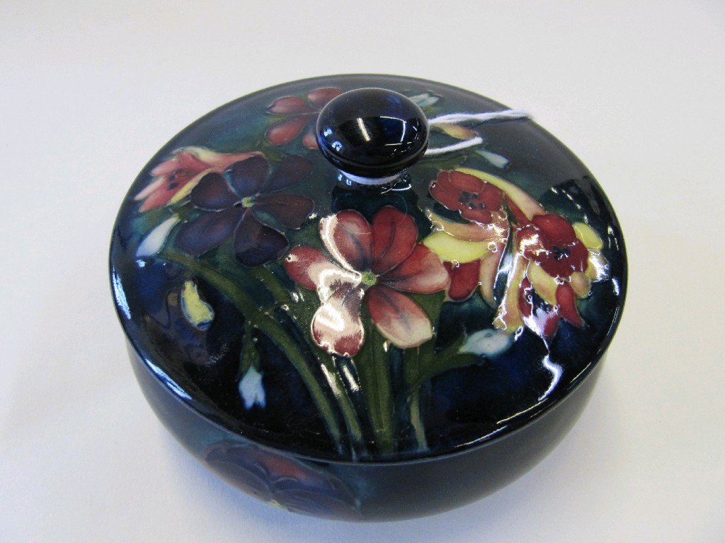 Appraisal: Moorcroft 'Spring Flowers' powder bowl and lid on blue green