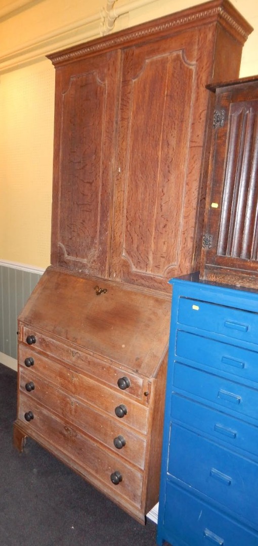 Appraisal: An oak bureau bookcase the top with a Greek key