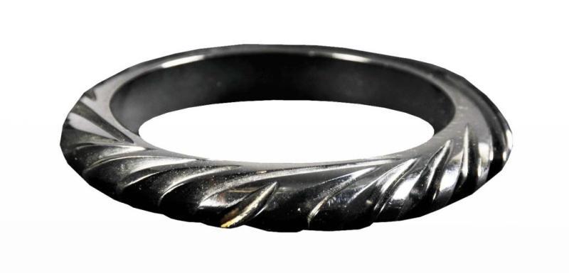 Appraisal: Bakelite Deeply Carved Black Wave-Like Bracelet Condition Near Mint Size