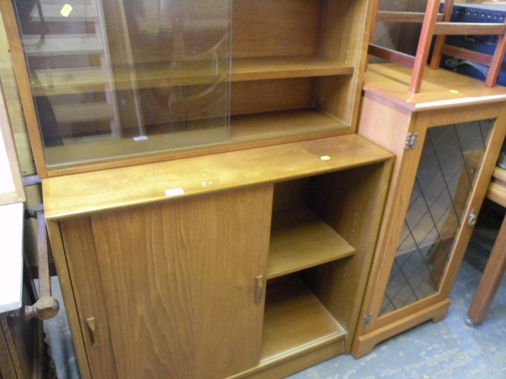 Appraisal: A teak cupboard with a glazed upper section a hi-fi