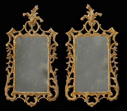 Appraisal: PAIR OF GEORGE III-STYLE CARVED GILTWOOD MIRRORS Each pierced frame