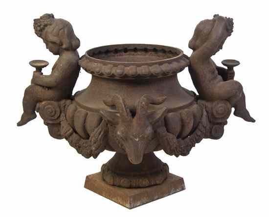 Appraisal: A Victorian Cast Iron Urn of baluster form with putti