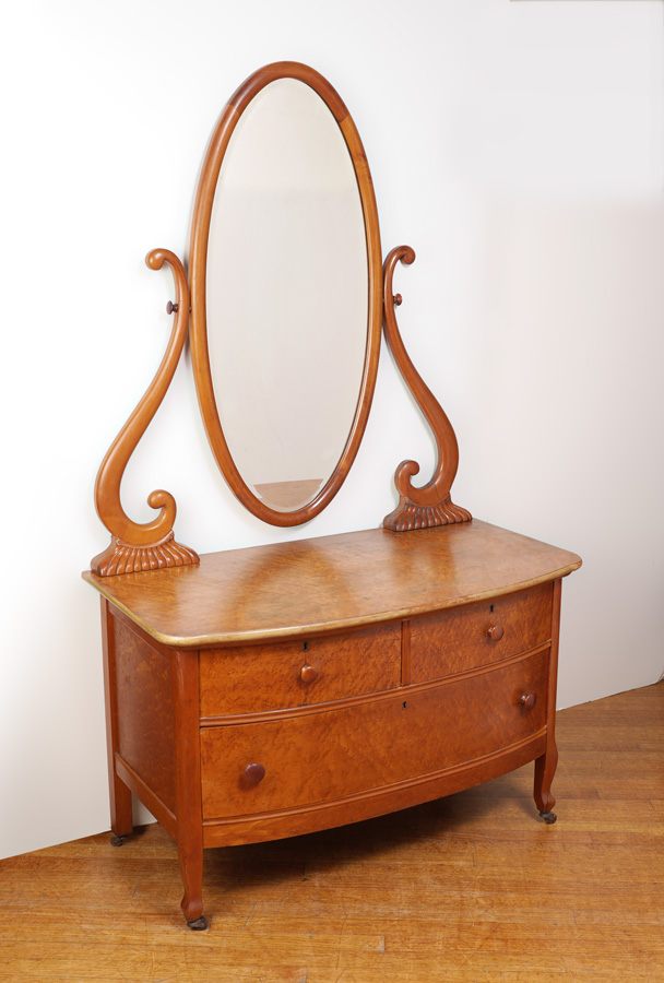 Appraisal: BIRDSEYE MAPLE VANITY WITH MIRROR Oval mirror with shaped supports