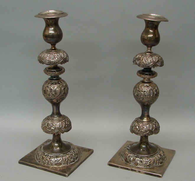 Appraisal: Candlesticks feature floral motif square bases marked on bases with