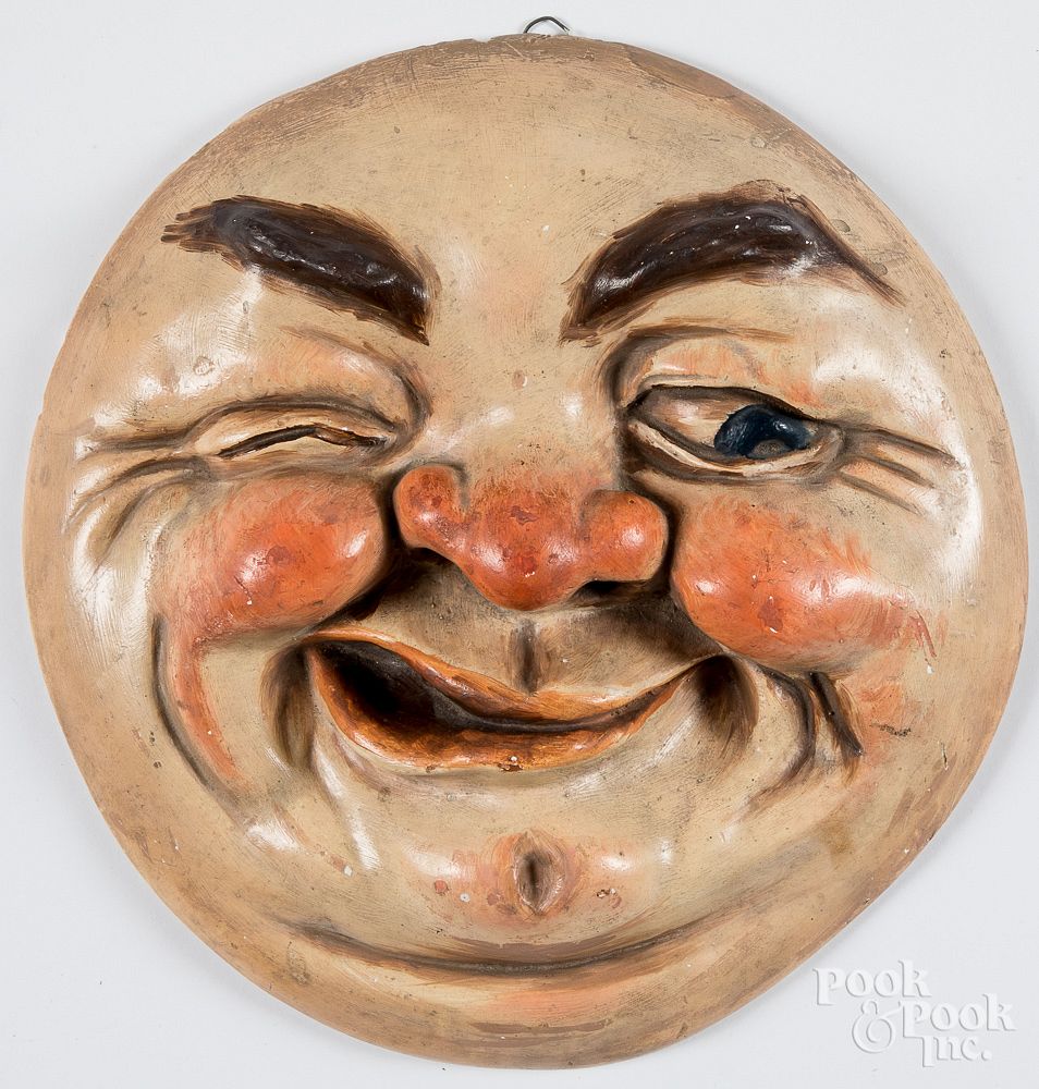 Appraisal: Painted chalk plaque of a red faced man Painted chalk