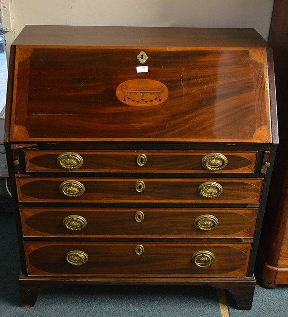 Appraisal: An Edwardian mahogany bureauthe fall front fitted with an arrangement