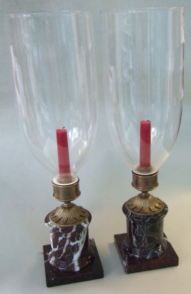 Appraisal: A pair of purple marble and gilt brass hurricane lamps