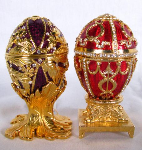 Appraisal: Two Edgar Berebi Jeweled Eggs including red enameled and purple