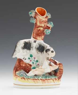 Appraisal: A Staffordshire Spill Vase Dog Rescuing Baby Black and white