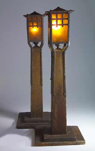 Appraisal: GUSTAV STICKLEY Pair of Newell post lamps with hammered copper