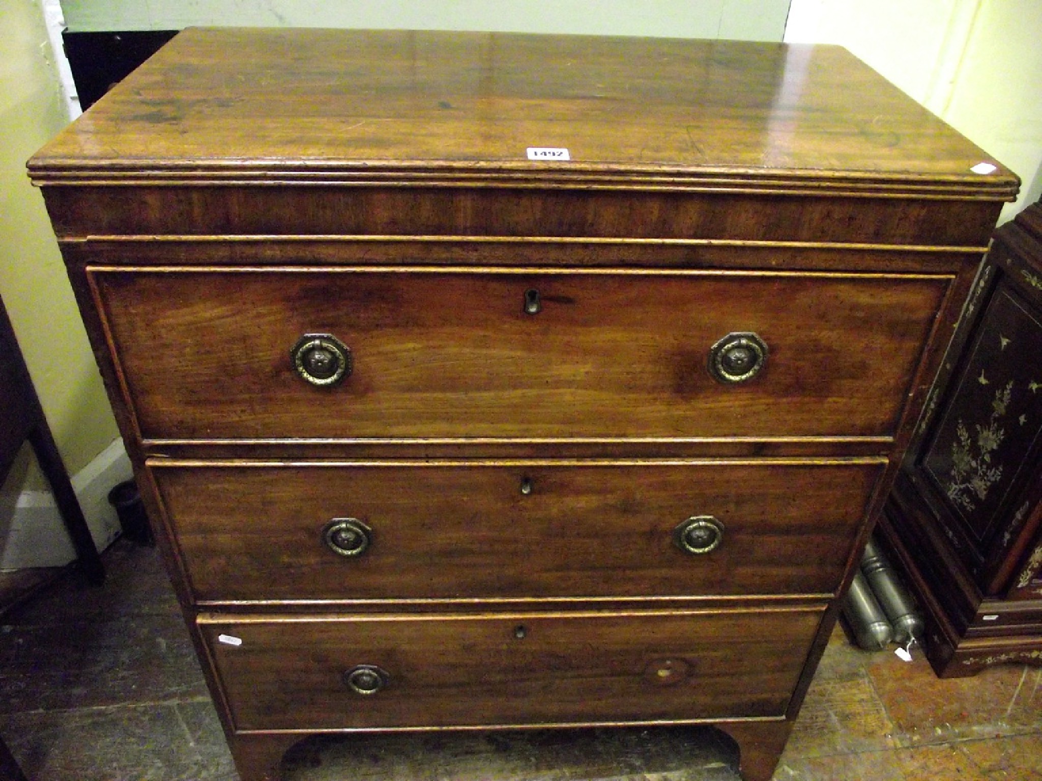 Appraisal: An unusually small Regency mahogany caddy top chest of three