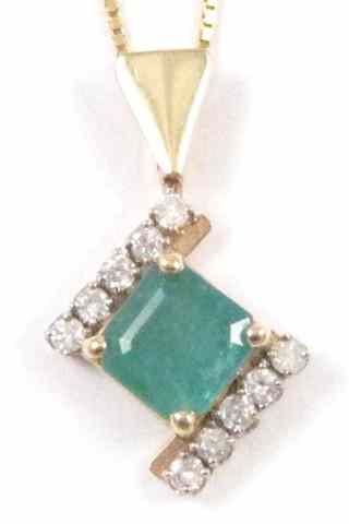 Appraisal: EMERALD AND DIAMOND PENDANT NECKLACE suspended on a '' chain