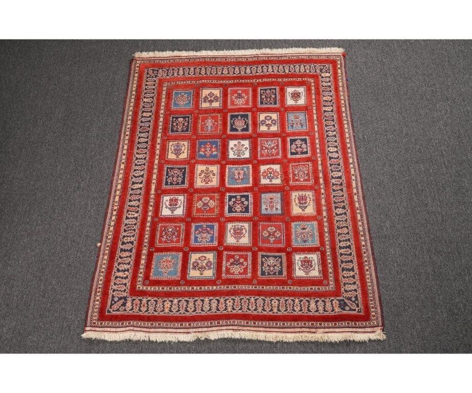 Appraisal: Persian center hall carpet with red field and colorful floral