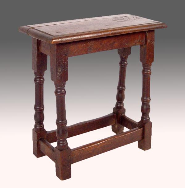 Appraisal: LATE ELIZABETHAN WALNUT STOOL With turned baluster legs joined by