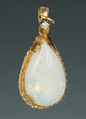 Appraisal: A Ladies' White Opal Pendant k yellow gold pendant featuring