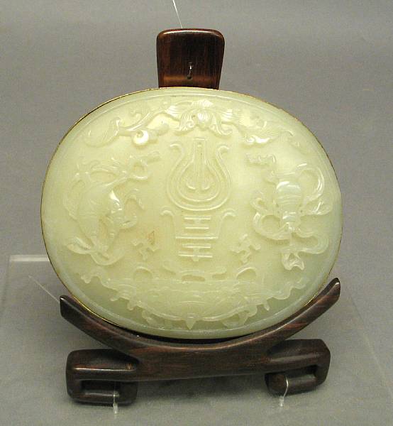 Appraisal: A white nephrite jade oval plaque th th Century Carved