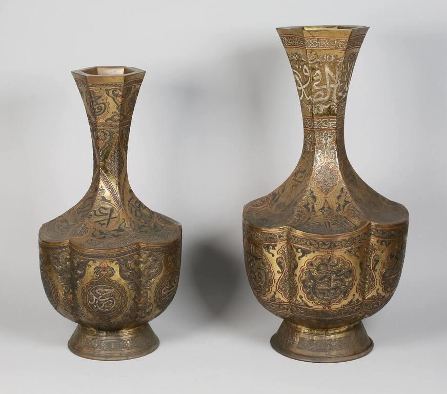 Appraisal: Islamic damascus metal vases Silver and cooper inlay on brass