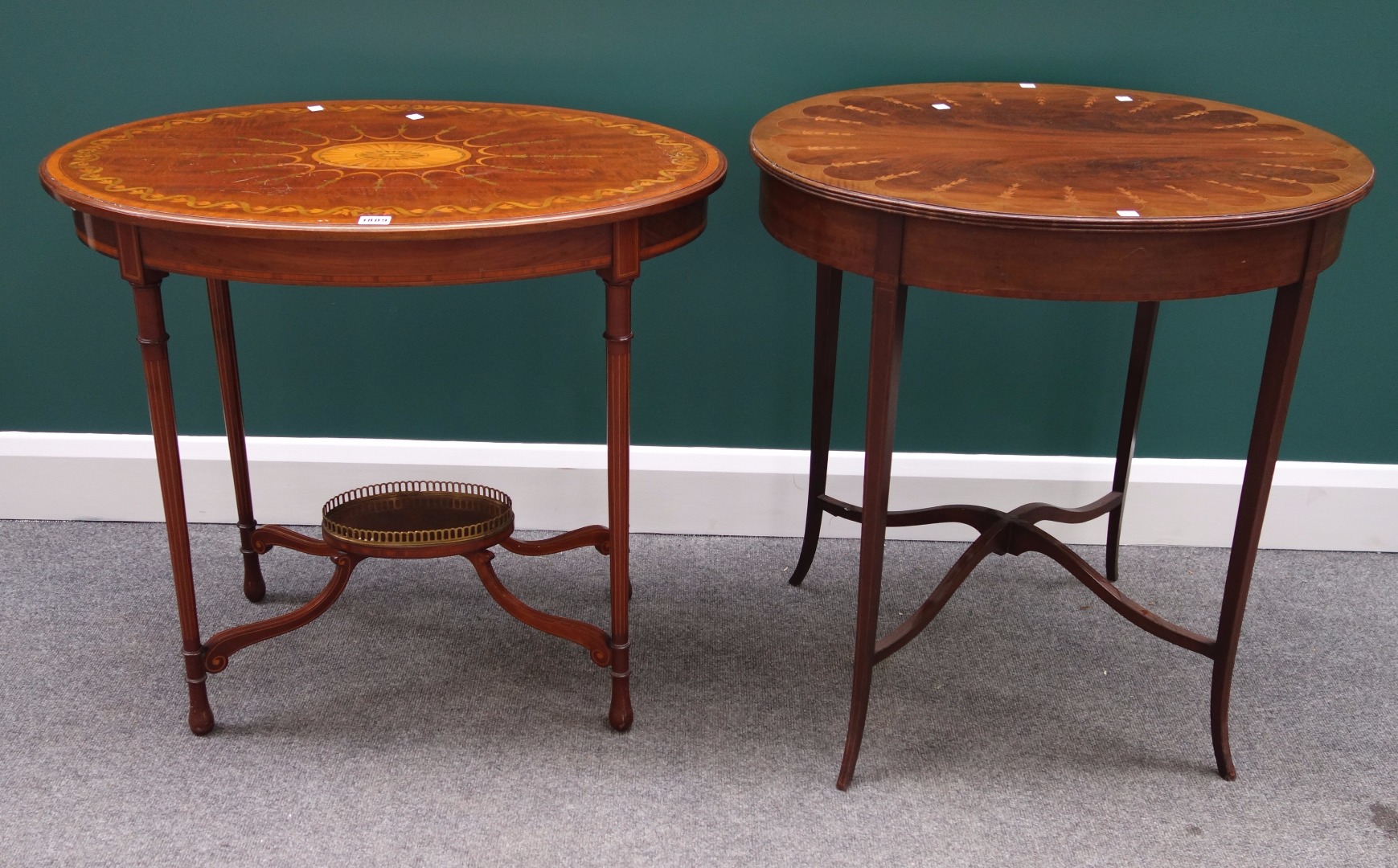 Appraisal: An Edwardian inlaid oval mahogany occasional table on four turned