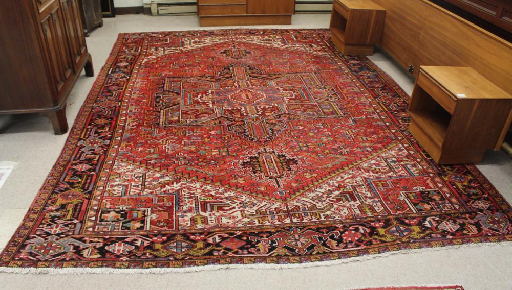 Appraisal: SEMI-ANTIQUE PERSIAN HERIZ CARPET East Azerbaijan Province northwestern Iran geometric