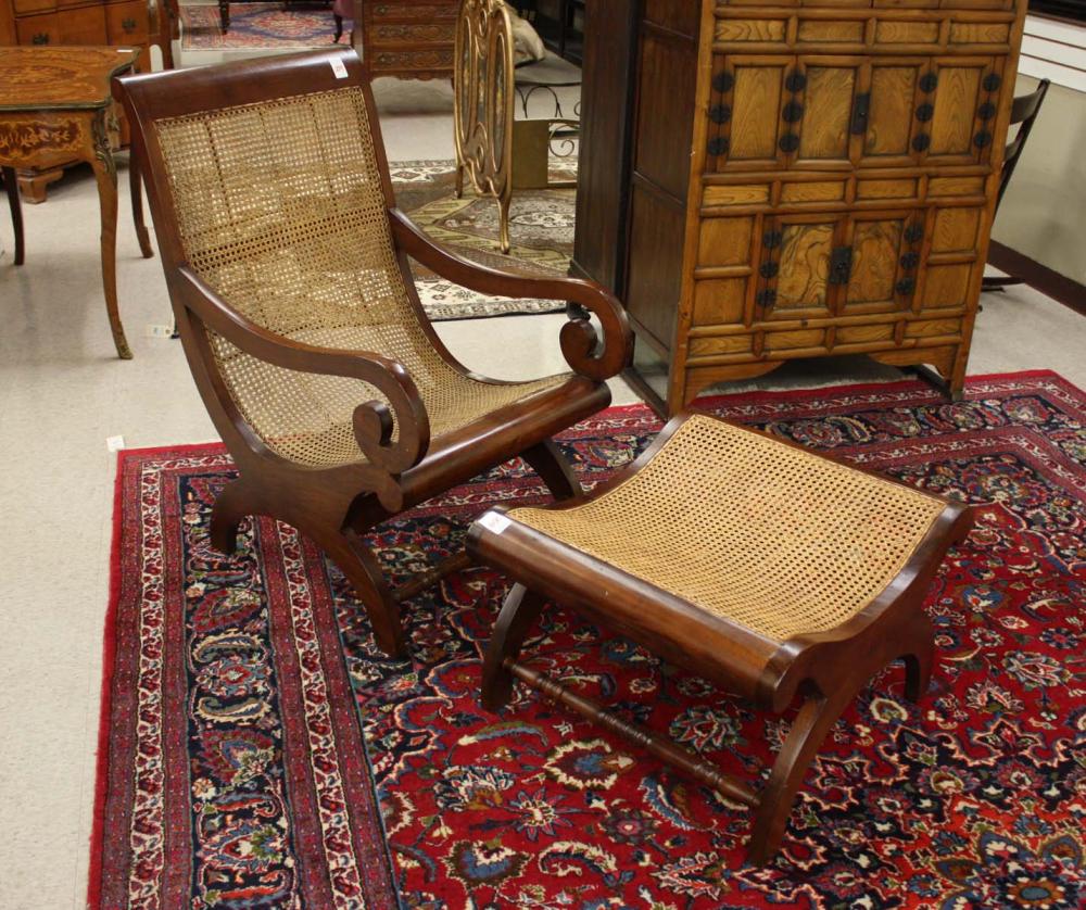 Appraisal: EMPIRE STYLE MAHOGANY ARMCHAIR AND MATCHING FOOTSTOOL the scroll-arm chair