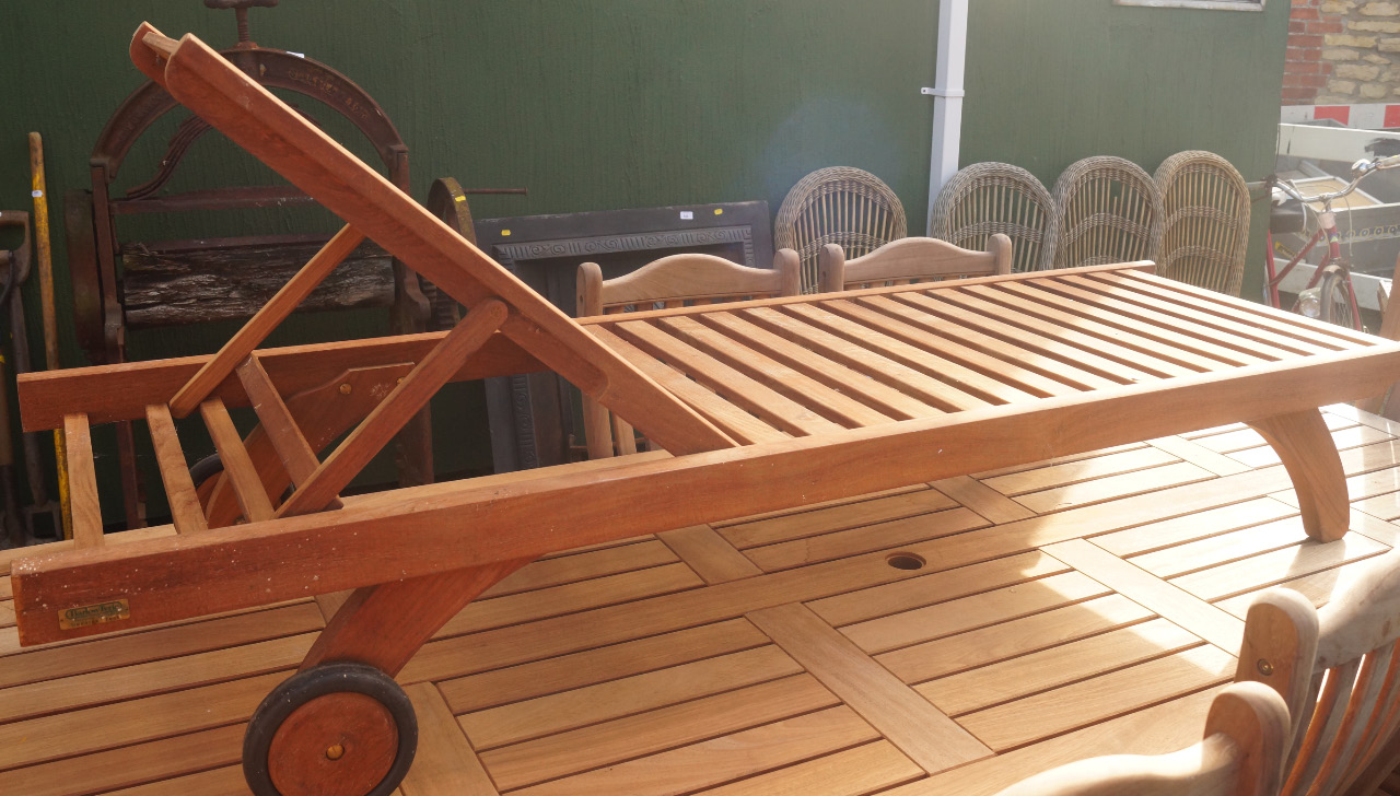 Appraisal: A Barlow Tyrie teak steamer lounger of rectangular outline with