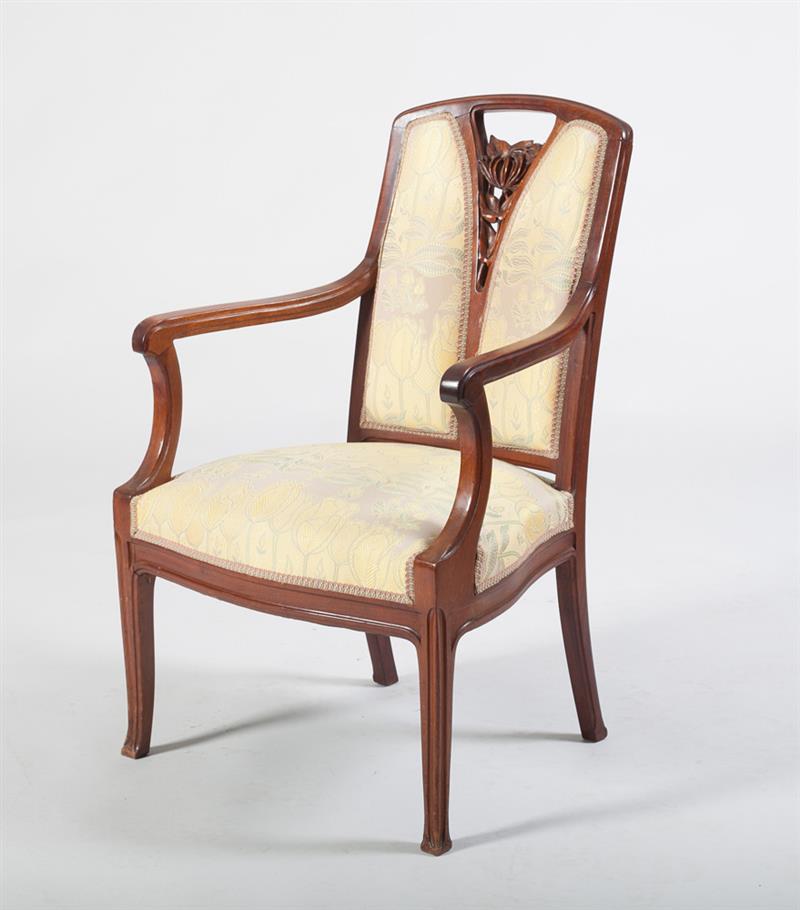 Appraisal: ART NOUVEAU CARVED MAHOGANY ARMCHAIR The arched top rail with