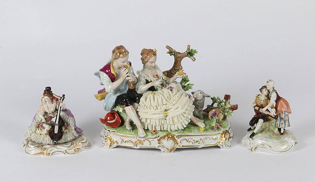 Appraisal: A CONTINENTAL PORCELAIN GROUP of a girl and a boy