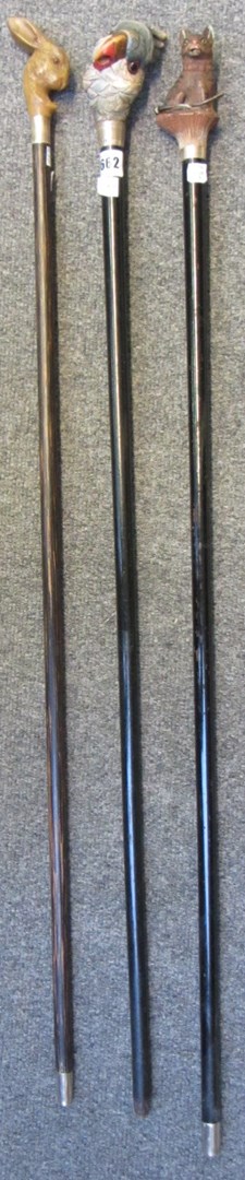 Appraisal: Three novelty walking sticks early th century each set with