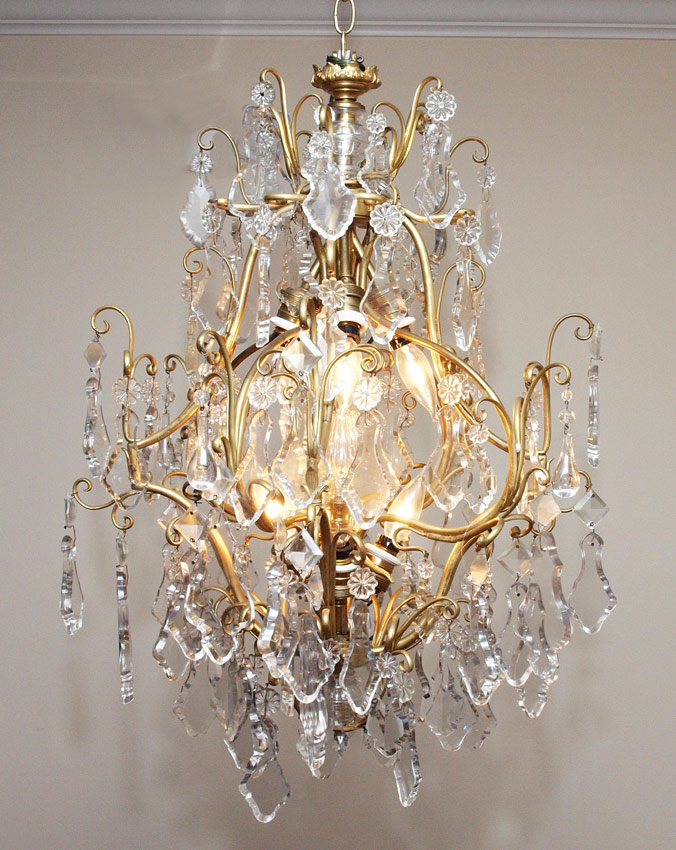 Appraisal: TIER BRASS AND CRYSTAL DROP CHANDELIER light brass frame with