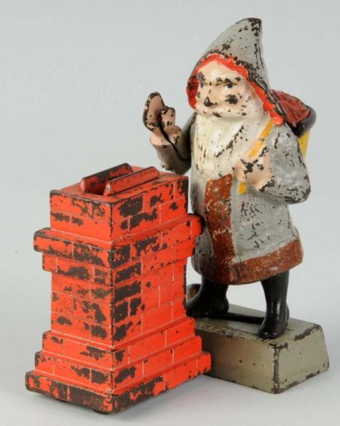 Appraisal: Cast Iron Santa by Chimney Mechanical Bank Description Manufactured by