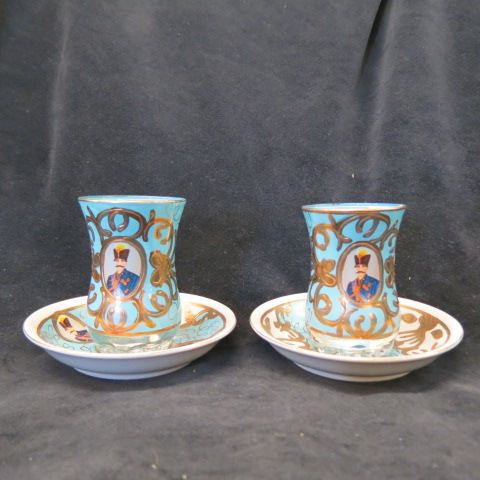 Appraisal: Pair of Persian Enameled Crystal TurkishCoffee Cups Saucers military figure